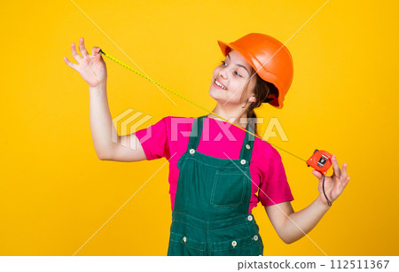 growing concept. little girl with measuring tape. instruments growing concept. little girl with measuring tape. instruments 112511367