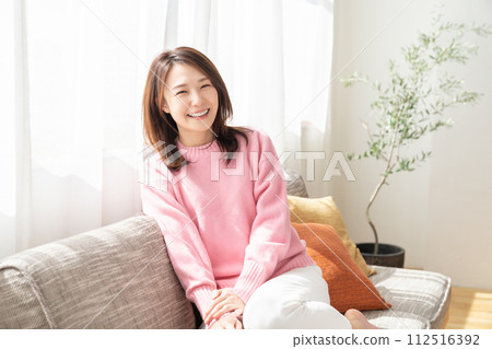 A young woman relaxing in the room 112516392