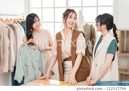 Women working in textile designers, fashion designers, pattern makers, stylists, and apparel. Women working in textile designers, fashion designers, pattern makers, stylists, and apparel. 112517794