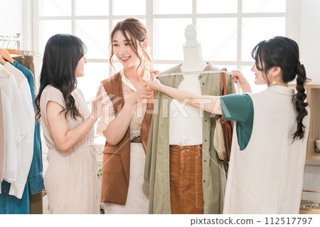 Women who work in fashion designers, pattern makers, stylists, and apparel. 112517797