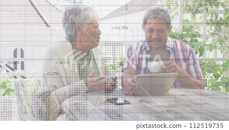 Statistical data processing against african american senior couple using digital tablet at home Statistical data processing against african american senior couple using digital tablet at home 112519735