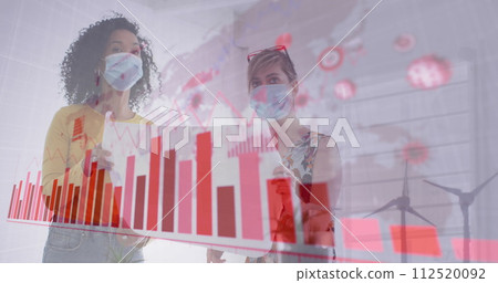 Image of digital interface showing statistics with colleagues in office wearing face masks Image of digital interface showing statistics with colleagues in office wearing face masks 112520092