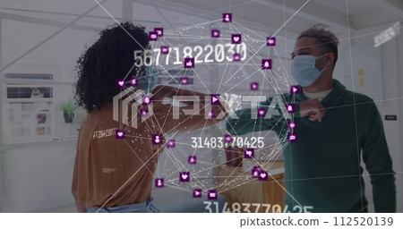 Image of floating numbers and net of connections with colleagues greeting in office wearing face mas 112520139