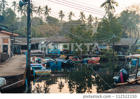 Boat at rural pier on island in the morning Boat at rural pier on island in the morning 112522150