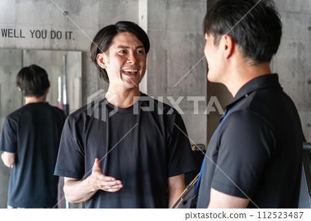 Young Asian man and personal trainer man receiving counseling in personal training 112523487