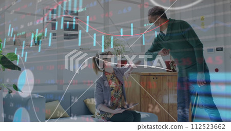 Image of digital interface showing statistics with colleagues in office wearing face masks 112523662