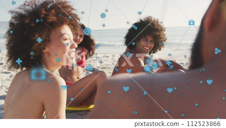 Image of network of digital icons over friends on beach Image of network of digital icons over friends on beach 112523866