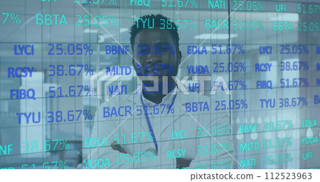 Image of digital interface showing statistics with doctor looking at camera and smiling 112523963