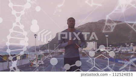 Image of shapes and dna strand over african american man running on promenade Image of shapes and dna strand over african american man running on promenade 112524853