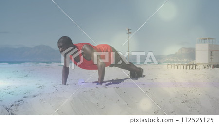 Image of spots over african american man exercising at beach Image of spots over african american man exercising at beach 112525125