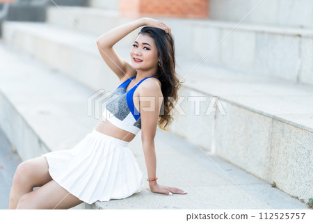 Portrait of beautiful athletic young asian woman in fashionable sportswear standing and having rest after strong exercise training in garden the park,Outdoor Sporty concept Portrait of beautiful athletic young asian woman in fashionable sportswear standing and having rest after strong exercise training in garden the park,Outdoor Sporty concept 112525757