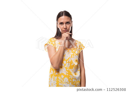 european surprised brunette lady with loose hair wearing a yellow t-shirt with a flower print european surprised brunette lady with loose hair wearing a yellow t-shirt with a flower print 112526308