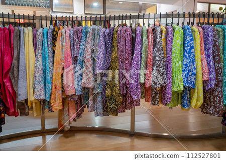 Various types of batik blouse for sale in the retail shop. Various types of batik blouse for sale in the retail shop. 112527801
