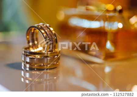 Two beautiful gold wedding rings.  112527882
