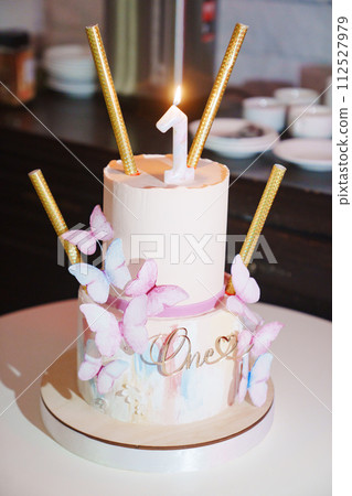 Two-tier butterfly cake for a girl's first birthday. Two-tier butterfly cake for a girl's first birthday. 112527979