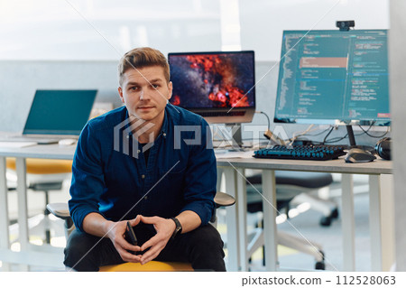 Programming. Man Working On Computer In IT Office, Sitting At Desk Writing Codes. Programmer Typing Data Code, Working On Project In Software Development Company 112528063