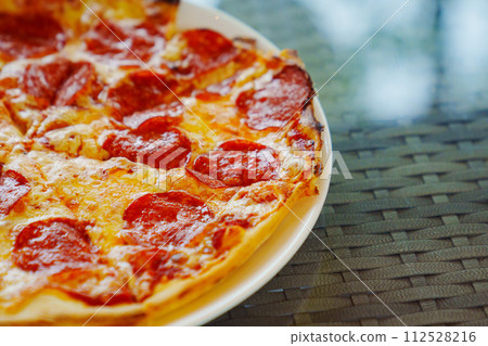 Close-up of pepperoni pizza.  112528216