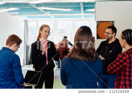 A diverse team of young business people exchanging ideas in a modern startup office A diverse team of young business people exchanging ideas in a modern startup office 112528269