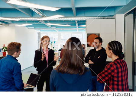 A diverse team of young business people exchanging ideas in a modern startup office A diverse team of young business people exchanging ideas in a modern startup office 112528312