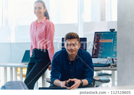 Programming. Man Working On Computer In IT Office, Sitting At Desk Writing Codes. Programmer Typing Data Code, Working On Project In Software Development Company 112528605