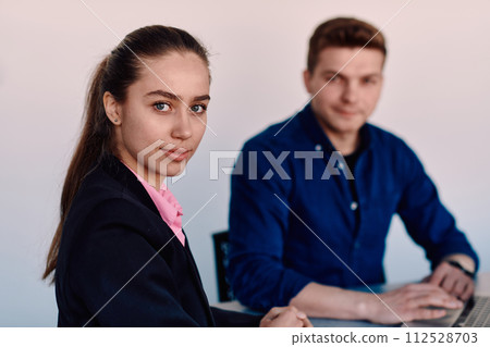 A business leader in a suit conversing with her worker in the IT industry about new business projects and existing business problems A business leader in a suit conversing with her worker in the IT industry about new business projects and existing business problems 112528703