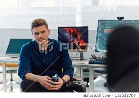 Programming. Man Working On Computer In IT Office, Sitting At Desk Writing Codes. Programmer Typing Data Code, Working On Project In Software Development Company 112528707