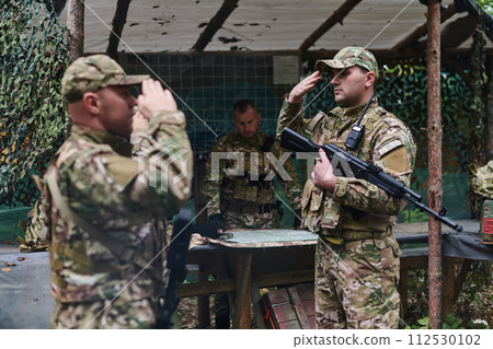 A dedicated soldier salutes his elite unit, showcasing camaraderie and readiness for the most perilous military operations 112530102