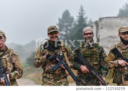 A disciplined and specialized military unit, donned in camouflage, strategically patrolling and maintaining control in a high-stakes environment, showcasing their precision, unity, and readiness for A disciplined and specialized military unit, donned in camouflage, strategically patrolling and maintaining control in a high-stakes environment, showcasing their precision, unity, and readiness for 112530259