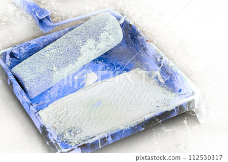 Painter craftsman artist tray,roller for painting,workplace with blue paint Painter craftsman artist tray,roller for painting,workplace with blue paint 112530317