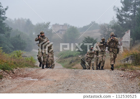 A disciplined and specialized military unit, donned in camouflage, strategically patrolling and maintaining control in a high-stakes environment, showcasing their precision, unity, and readiness for 112530525