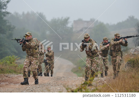 A disciplined and specialized military unit, donned in camouflage, strategically patrolling and maintaining control in a high-stakes environment, showcasing their precision, unity, and readiness for 112531180
