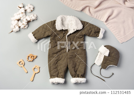 Gray quilted baby overalls for winter flat lay 112531485