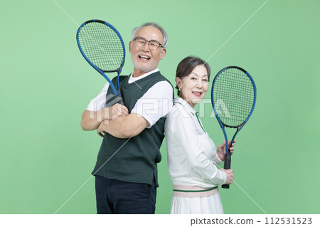 A senior with a tennis racket 112531523