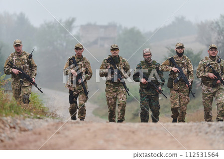 A disciplined and specialized military unit, donned in camouflage, strategically patrolling and maintaining control in a high-stakes environment, showcasing their precision, unity, and readiness for 112531564