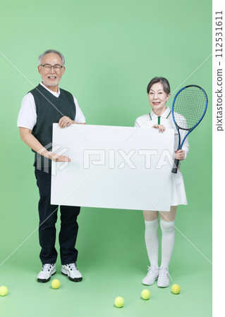 A senior woman holding a tennis racket 112531611