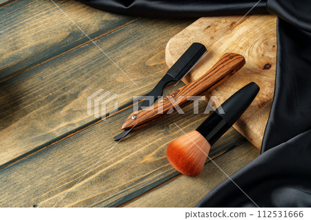 Set of professional barber tools on wooden table 112531666