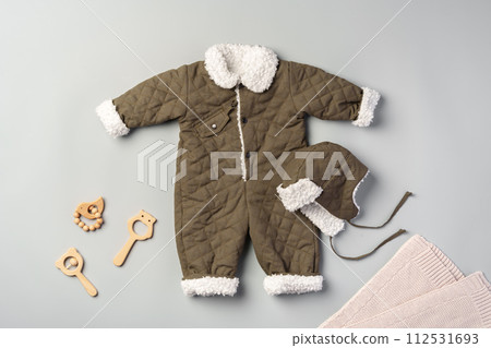 Gray quilted baby overalls for winter flat lay Gray quilted baby overalls for winter flat lay 112531693