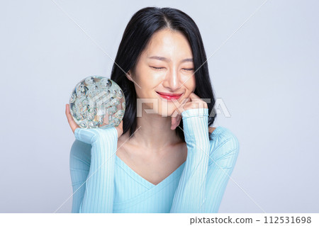 A woman holding a glass sculpture A woman holding a glass sculpture 112531698