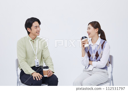 A man and a woman talking to over a cup of coffee A man and a woman talking to over a cup of coffee 112531797