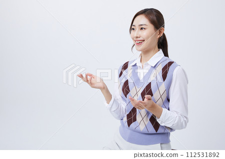 A woman who explains in a chair with her employee ID around her neck 112531892