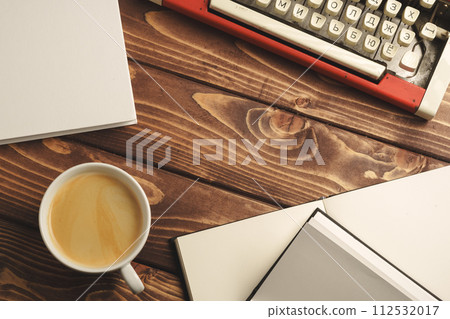 Vintage typewriter on wooden table close up 112532017