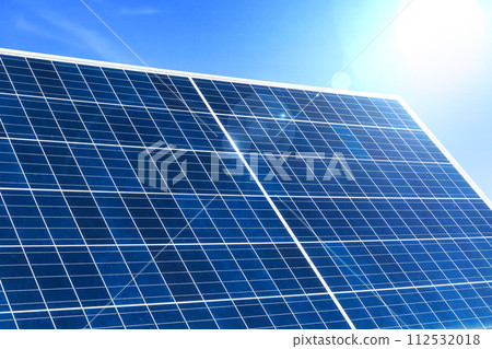 Image of solar panel with sunlight on blue sky background. Image of solar panel with sunlight on blue sky background. 112532018