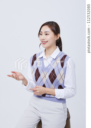 A woman who explains in a chair with her employee ID around her neck 112532080