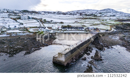 Aerial view of a snow covered Portnoo harbour in County Donegal, Ireland. 112532242