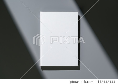 White notepad with hard cover on gray background 112532433