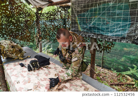 The esteemed leader of an elite military unit, strategic brilliance unfolds as he meticulously devises tactical plans for the upcoming military operation, surrounded by cutting-edge technology and a The esteemed leader of an elite military unit, strategic brilliance unfolds as he meticulously devises tactical plans for the upcoming military operation, surrounded by cutting-edge technology and a 112532456