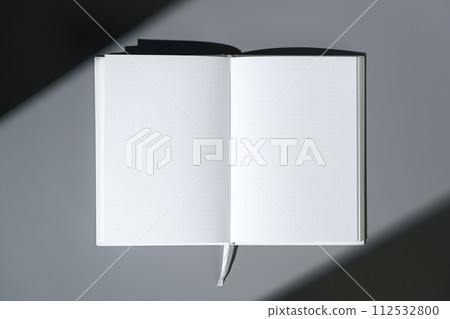 Blank open notepad on gray background studio shot 112532800