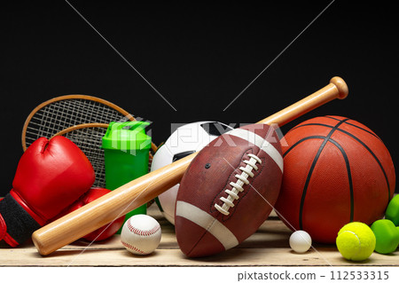 Various sports equipment on black background studio shot Various sports equipment on black background studio shot 112533315