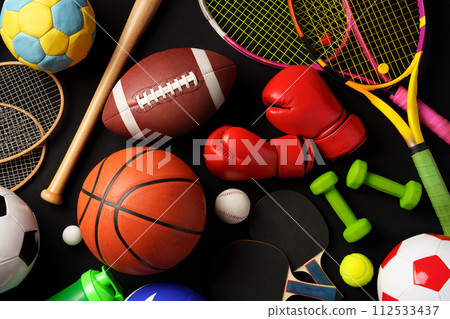 Various sports equipment on black background studio shot 112533437