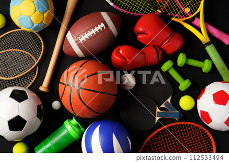 Various sports equipment on black background studio shot Various sports equipment on black background studio shot 112533494